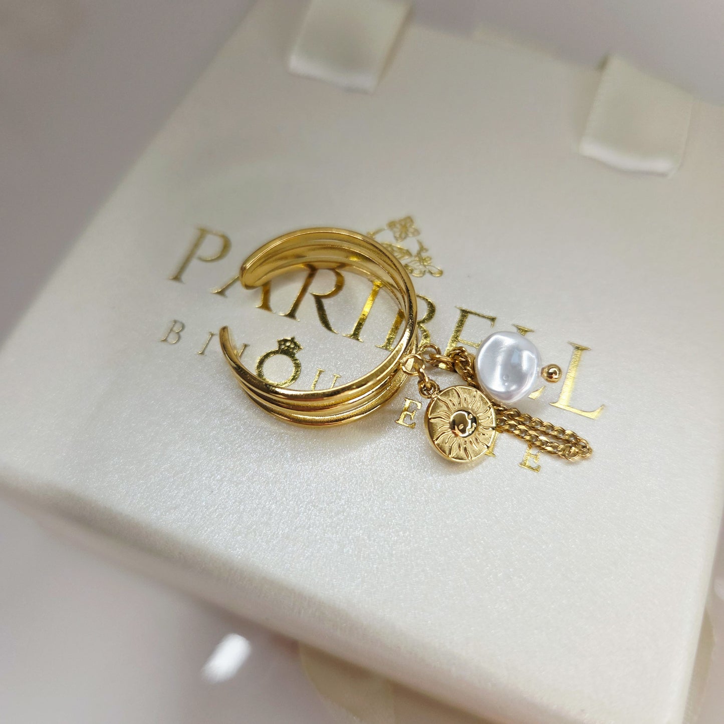 bague multi-anneaux avec pendentifs (soleil + perle + chaîne)
