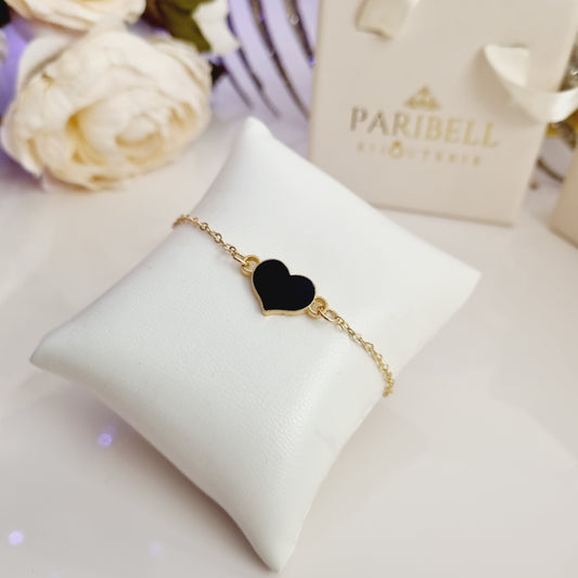 Bracelet doré ajustable avec cœur et pierre noire scintillante.
