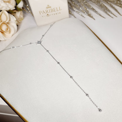 Idée cadeau parfaite : un collier sautoir élégant en acier inoxydable argenté, livré dans un écrin luxueux. Ressentez la joie d’offrir (ou de recevoir) un bijou raffiné qui symbolise la grâce et l’élégance éternelle.
