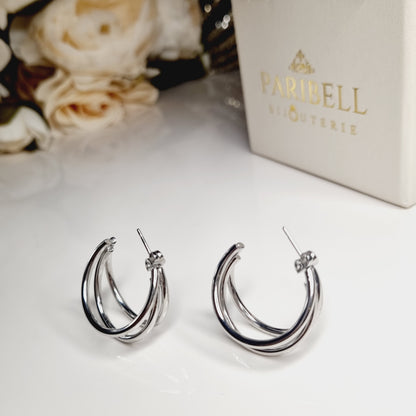 Boucles d'Oreilles Créoles à Triple Anneau en Acier Inoxydable Argenté, parfaites pour une élégance contemporaine.