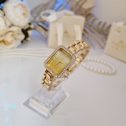 Montre Calysti dorée à strass avec cadran rectangulaire brillant